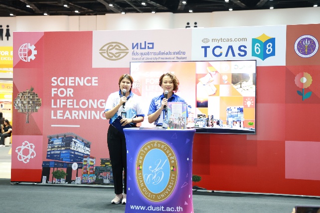 A couple of people standing at a podium
AI-generated content may be incorrect.