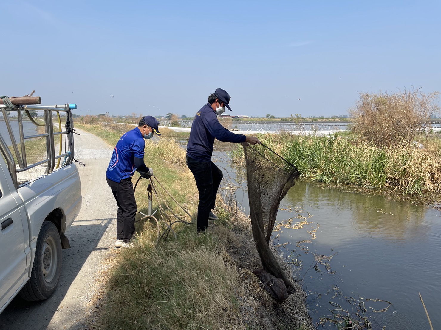 A group of men fishing in the water

Description automatically generated
