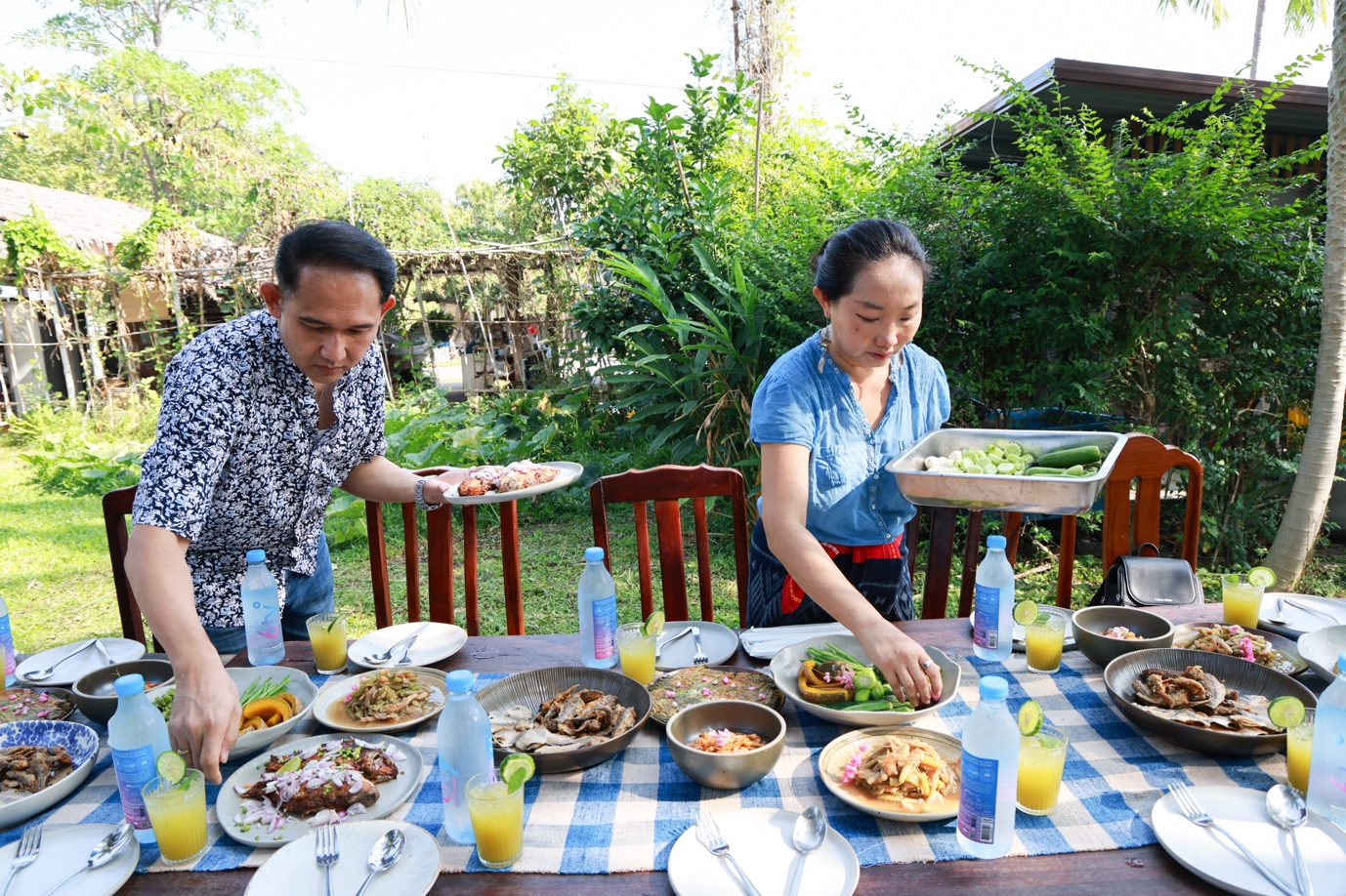 A group of people at a table with food
Description automatically generated