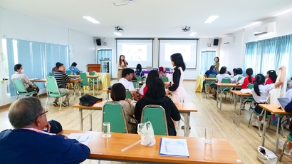 A group of people in a classroom

Description automatically generated