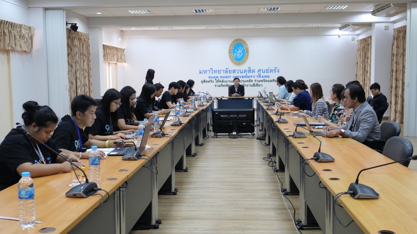 A group of people in a room

Description automatically generated