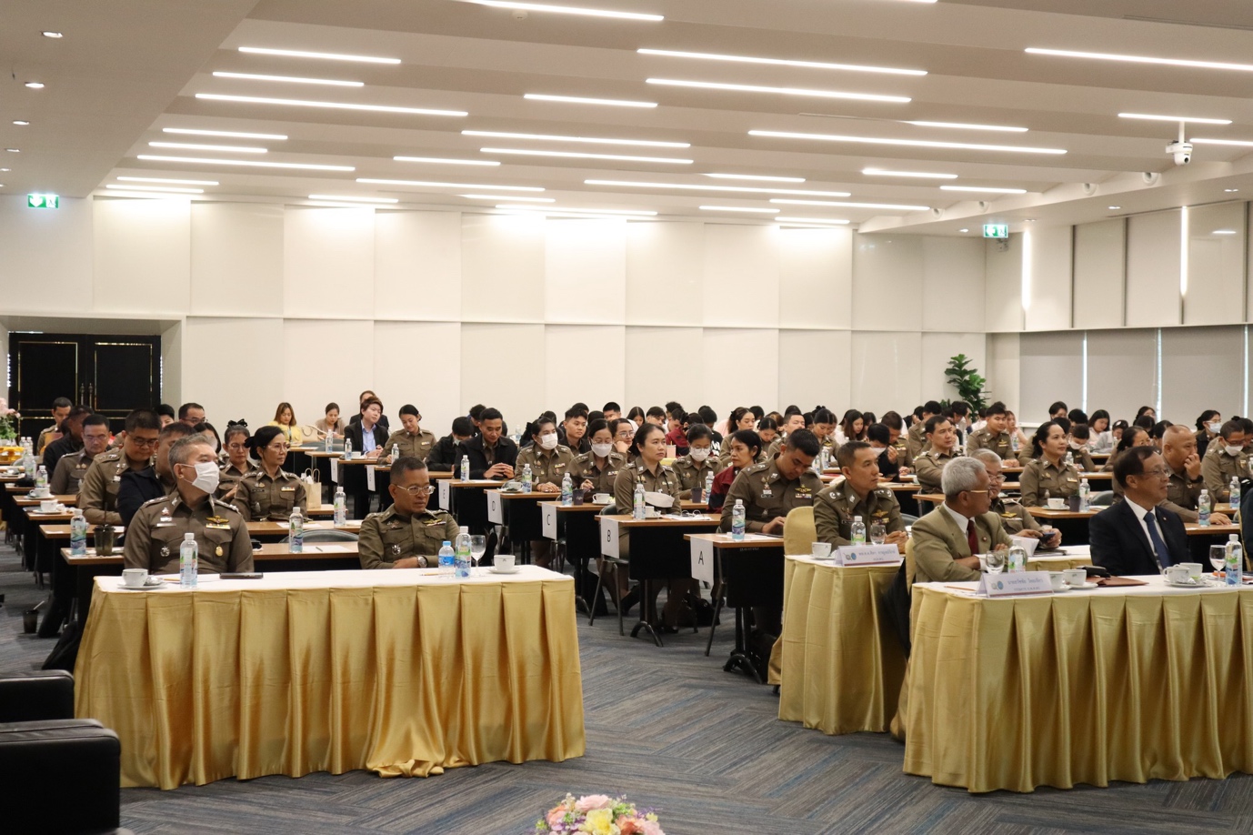 A group of people in a room
Description automatically generated