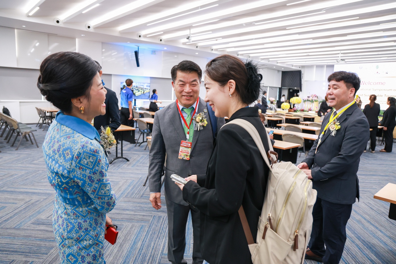 A group of people in a room
Description automatically generated