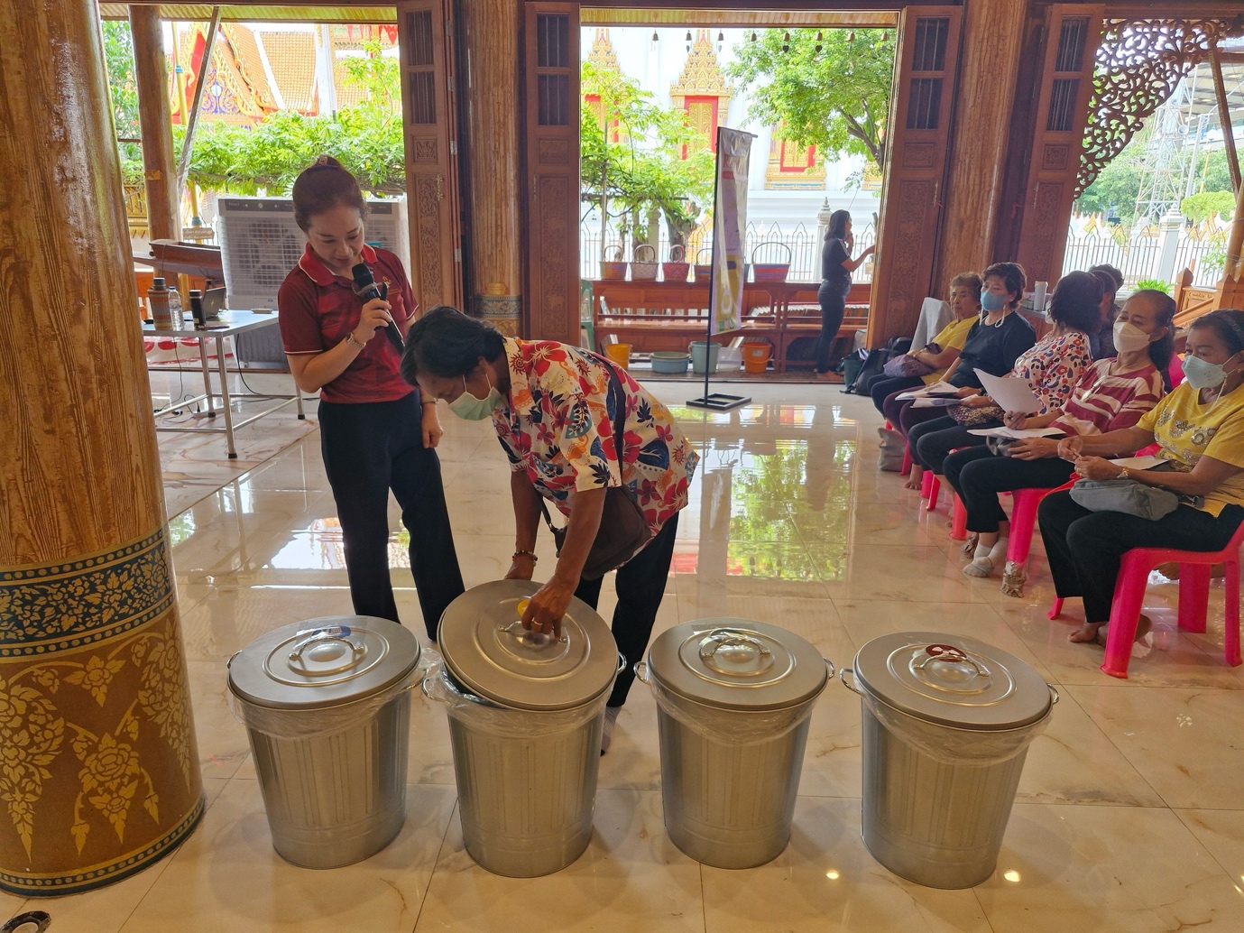 A group of people in a room
Description automatically generated