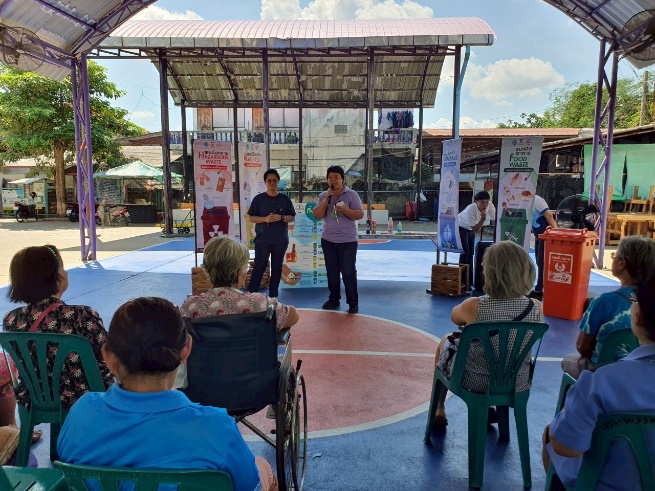 A group of people in chairs and a basketball court
AI-generated content may be incorrect.