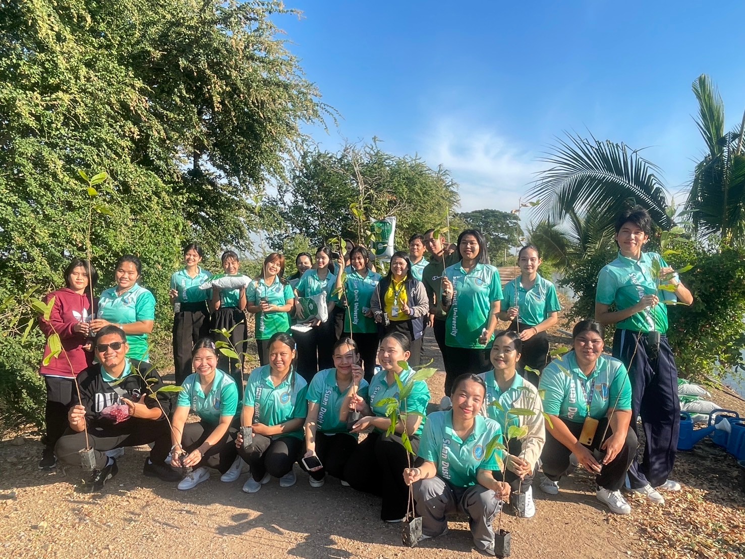 A group of people posing for a photo
Description automatically generated