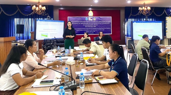 A group of people sitting at a table

AI-generated content may be incorrect.