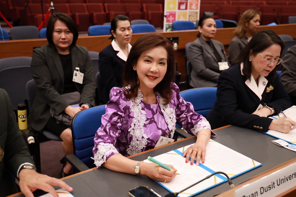 A group of people sitting at a table

Description automatically generated