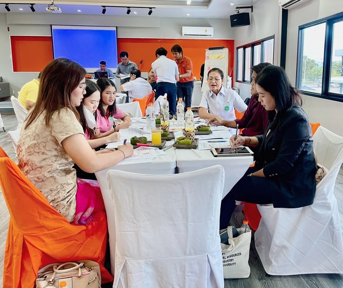 A group of people sitting at a table

Description automatically generated