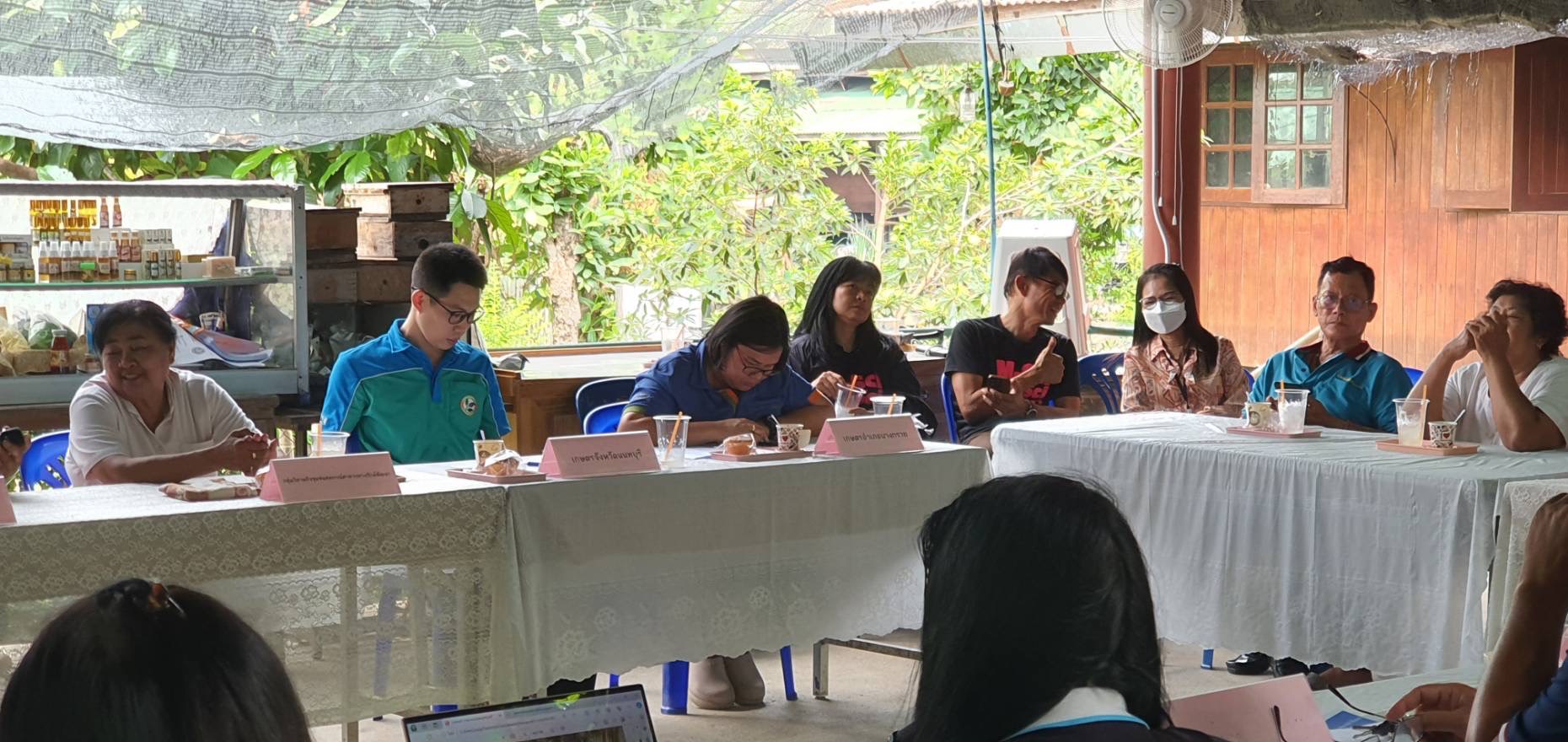 A group of people sitting at a table

Description automatically generated