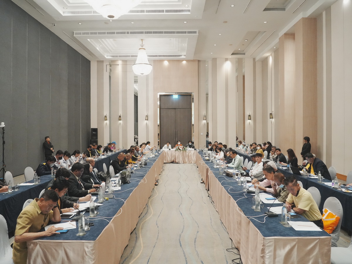 A group of people sitting at a table
Description automatically generated