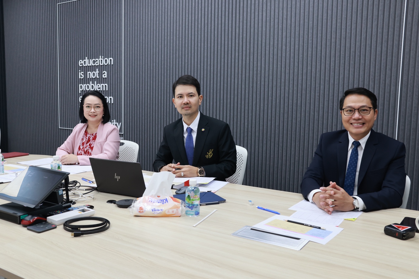 A group of people sitting at a table

Description automatically generated