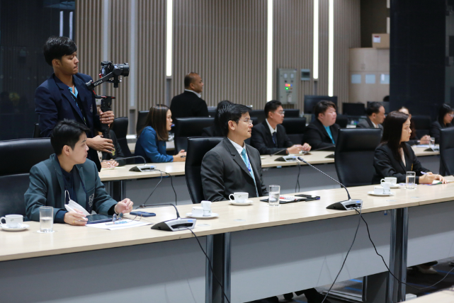 A group of people sitting at tables with microphones

AI-generated content may be incorrect.