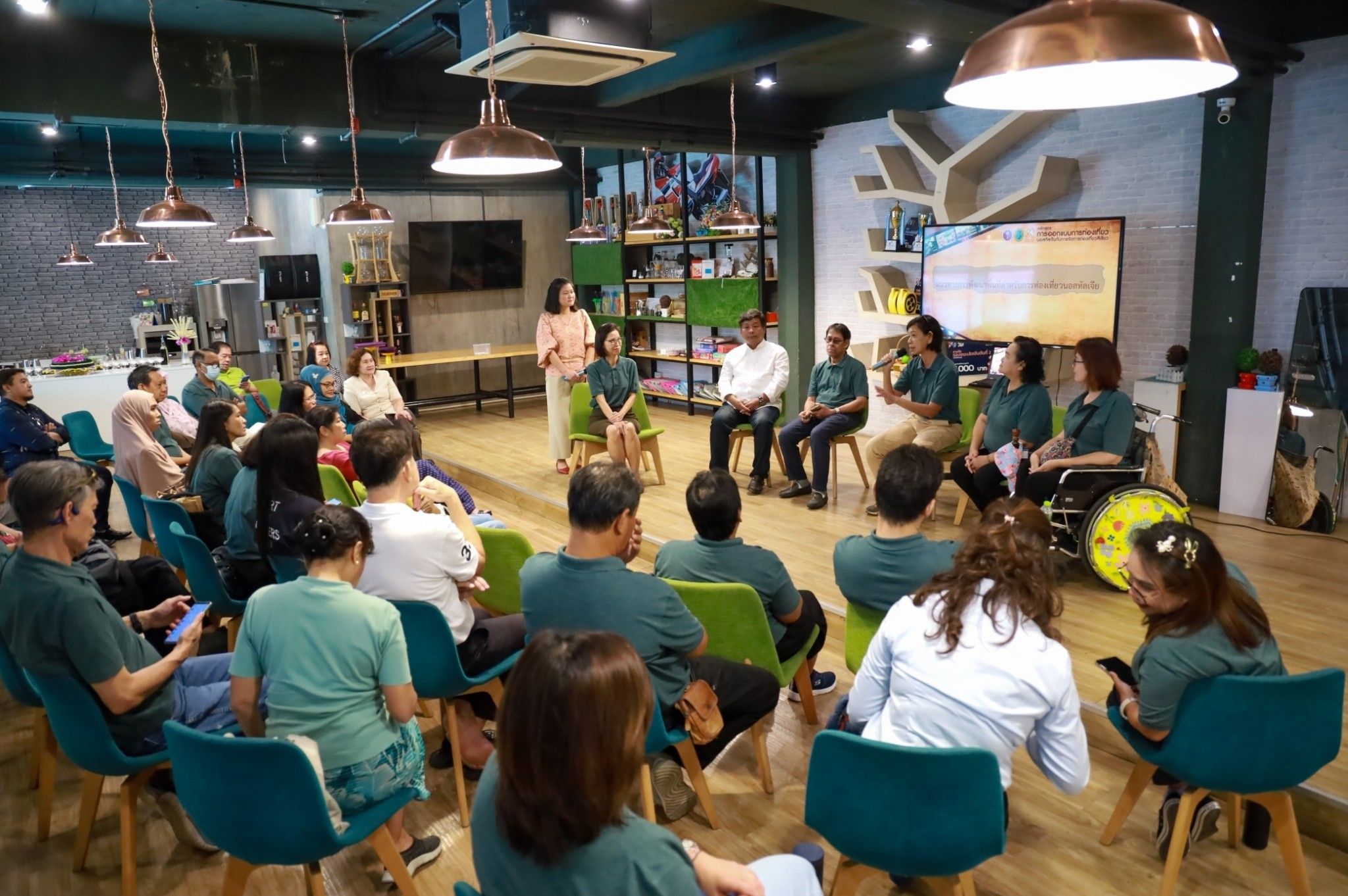 A group of people sitting in chairs

Description automatically generated