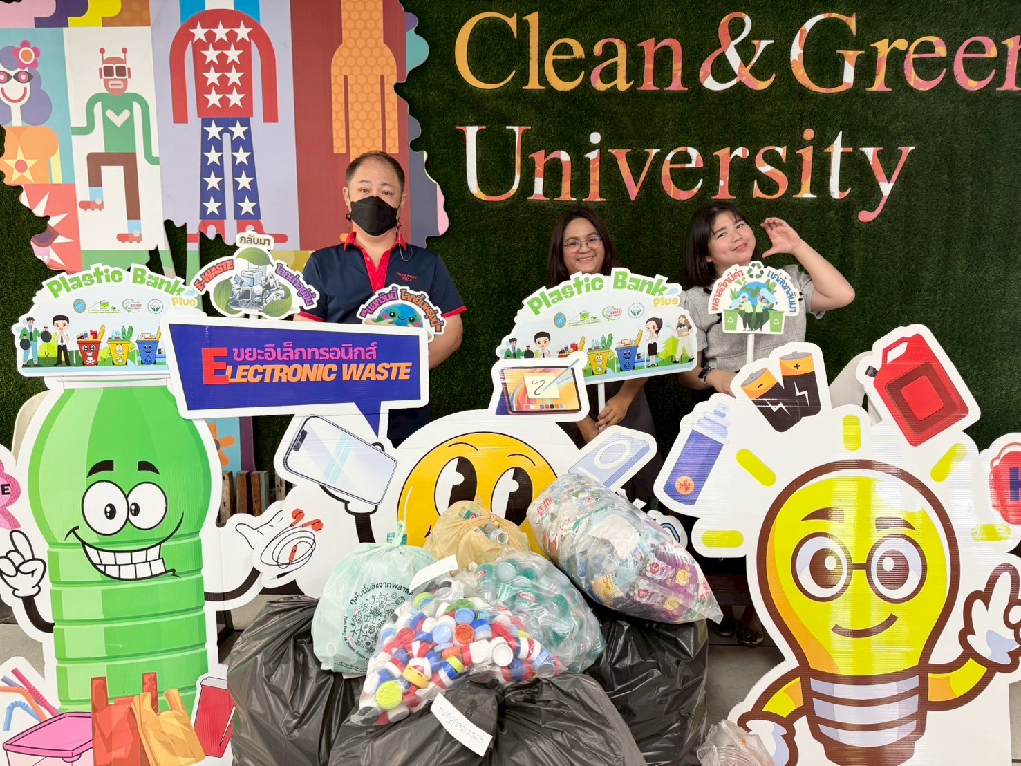 A group of people standing in front of a sign
Description automatically generated