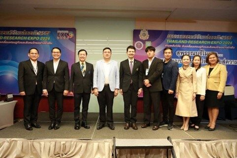 A group of people standing on a stage
Description automatically generated