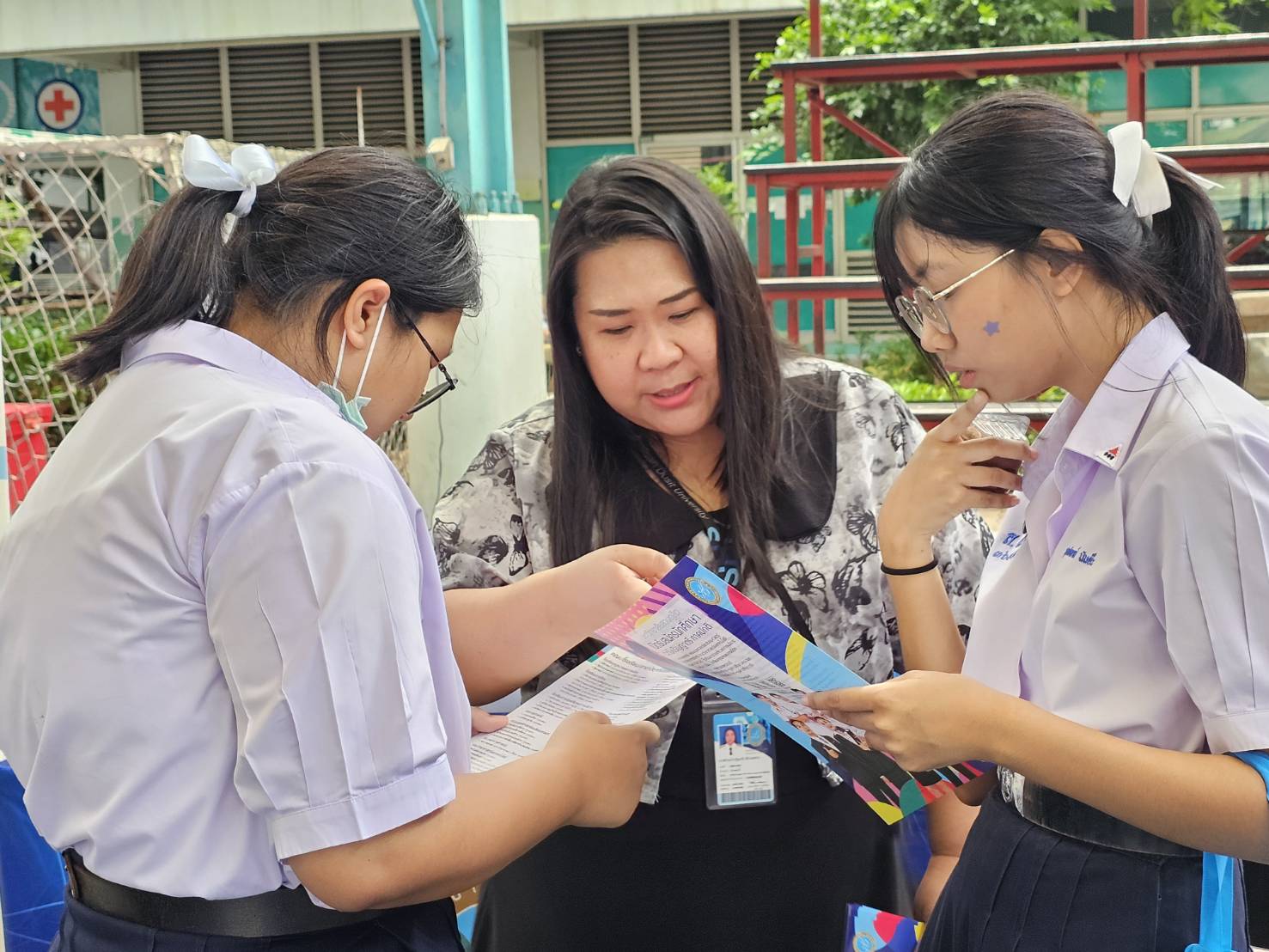 A group of women looking at a piece of paper
AI-generated content may be incorrect.