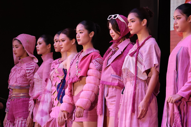 A group of women wearing pink clothes
AI-generated content may be incorrect.