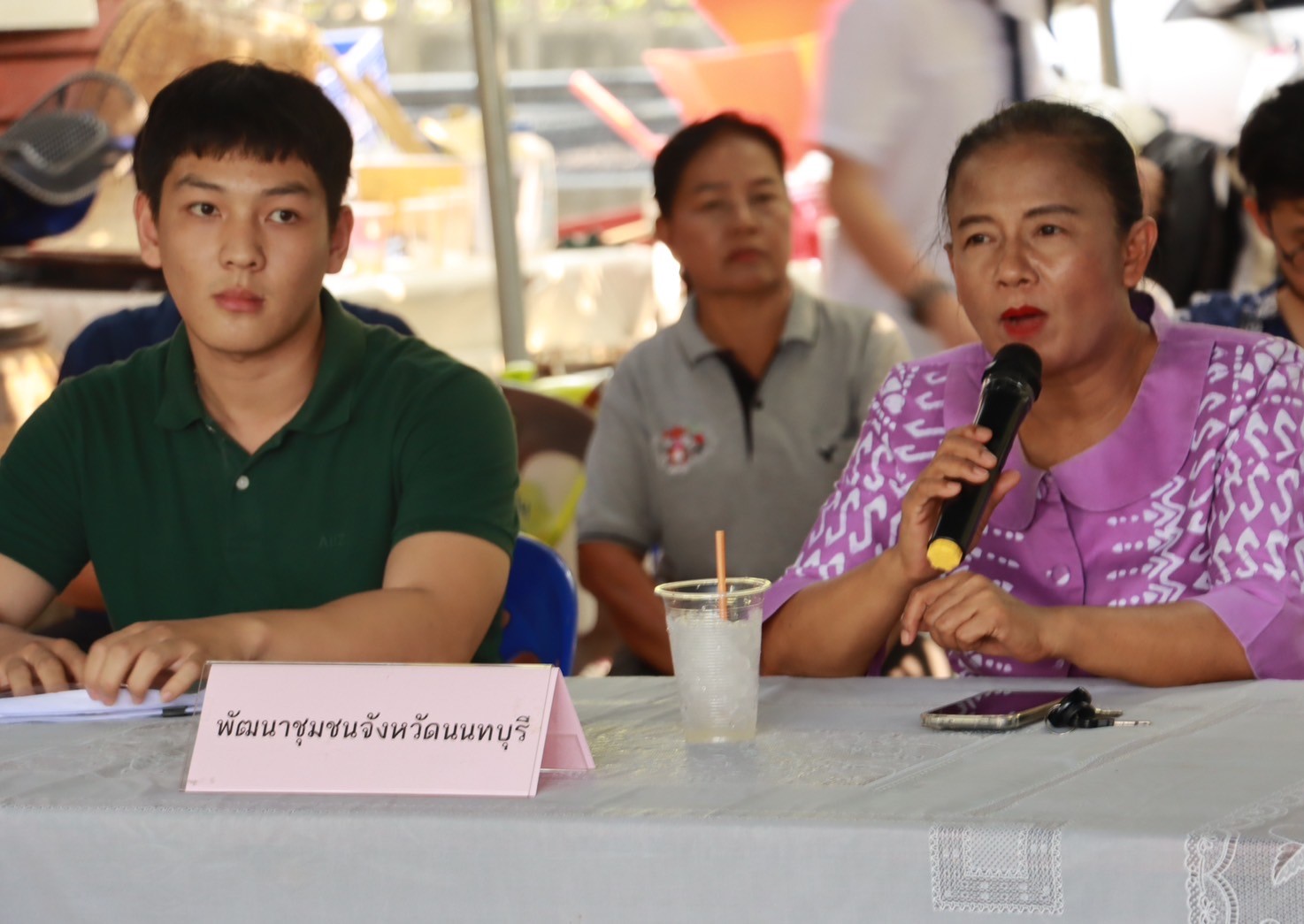 A person and person sitting at a table
Description automatically generated