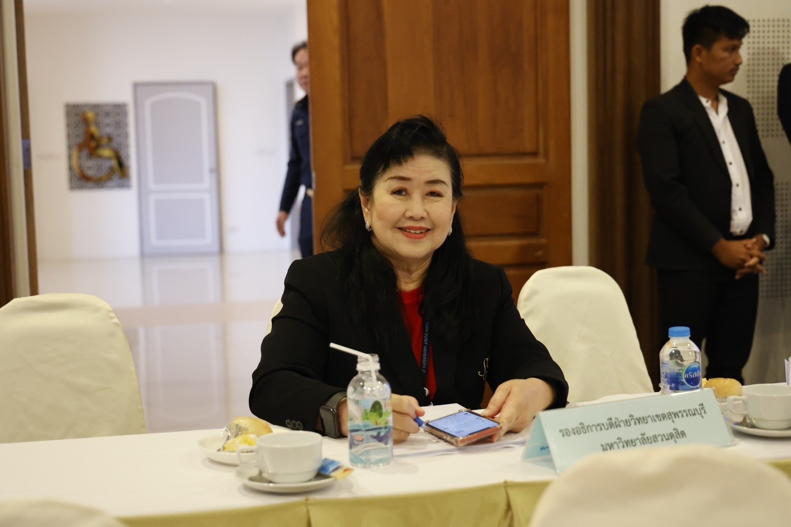 A person sitting at a table

Description automatically generated