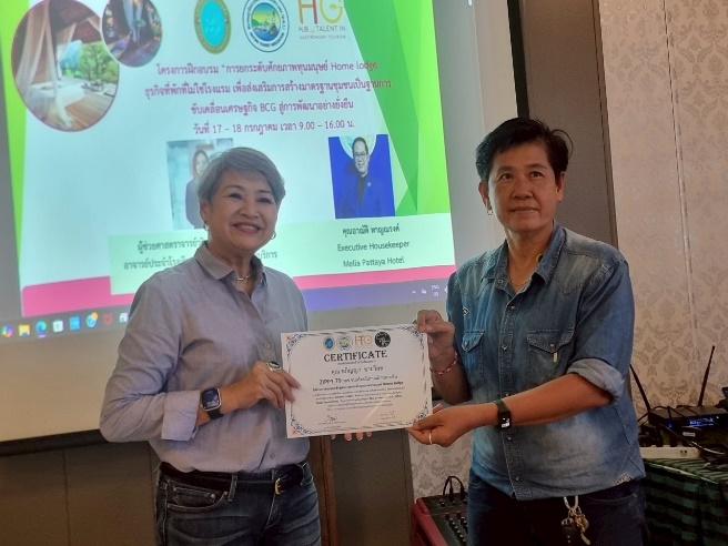 Two women holding a certificate

AI-generated content may be incorrect.